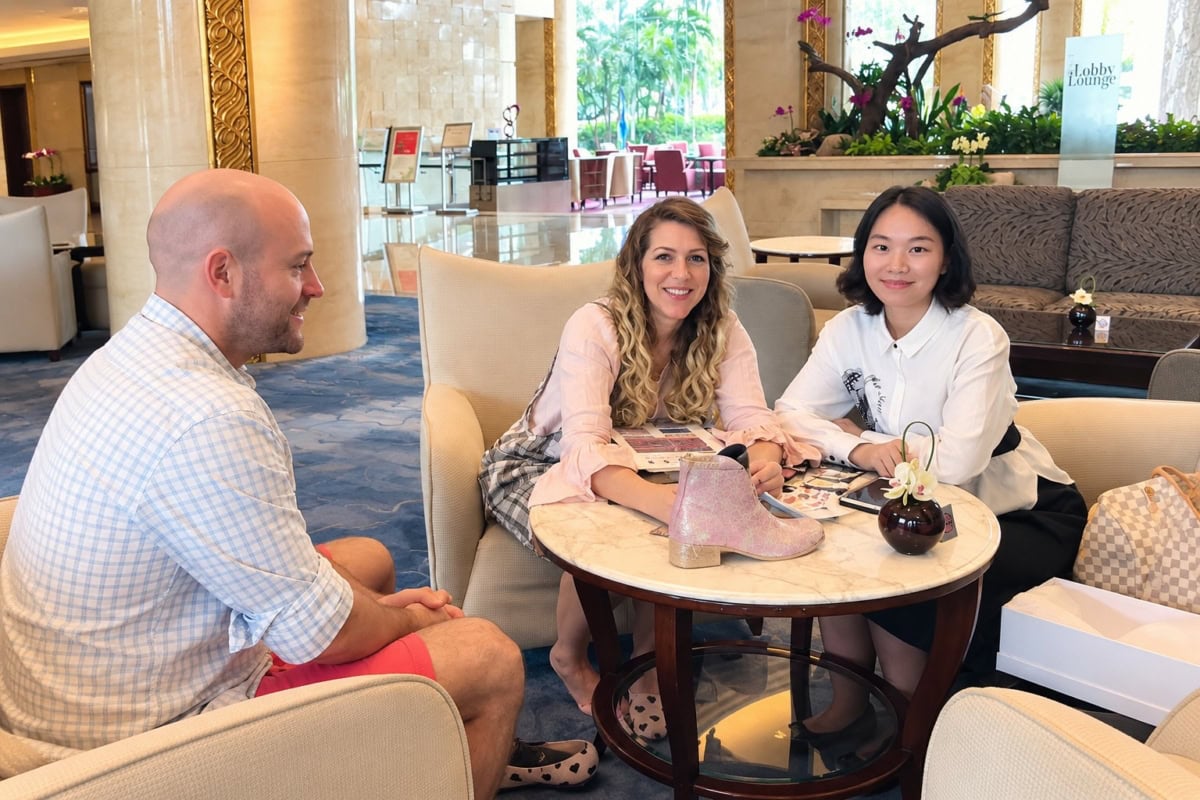 HoldingStyle shoe manufacturer meeting with clients for custom footwear development